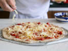 Team Building Cooking Class - Sweet and Savory Baking 101 in Manhattan: chef making homemade pizza