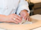 Cooking Class - Southeast Asia Culinary Expedition: chef making lumpia rolls