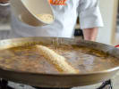 Cooking Class - Vegan Spanish Paella Feast in Cambridge: chef making paella