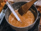 Cooking Class - Culinary Inspiration From Africa in Brooklyn: chef making rum caramel sauce
