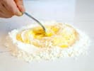 Cooking Class - Authentic Handmade Pasta: chef mixing flour and eggs to make pasta dough