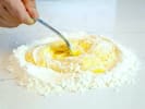 Cooking Class - Italian Classics From Scratch: chef mixing flour and eggs to make pasta dough