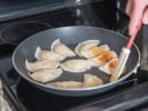 Online Couples Cooking Class - Japanese Miso Soup and Gyoza: chef pan searing gyoza