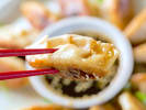 Cooking Class - Signature Asian Favorites: chef presenting fresh made dumpling