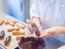 Team Building Cooking Class - Best of a French Cafe in Downtown Dallas: chef presenting freshly piped eclair