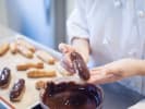 Cooking Class - French Pastries 101: chef presenting freshly piped eclair
