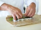 Team Building Cooking Class - Sushi Battle Royale in Culver City: chef rolling a vegetable sushi roll