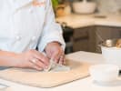 Team Building Cooking Class - Vietnamese Street Food in DC: chef rolling fresh spring rolls