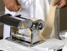 Cooking Class - Mastery of Seafood Favorites: chef rolling out homemade pasta dough