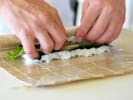 Team Building Cooking Class - Japanese Dinner Party Menu in Boston Proper: chef rolling vegetable sushi roll