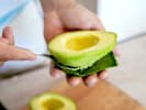 Cooking Class - Upscale Sushi Rolls: chef scooping out avocado