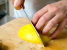 Cooking Class - Authentic Taste of Thailand in Austin: chef slicing a mango