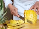 Cooking Class - Fresh and Healthy Vegan Tacos: chef slicing a pineapple