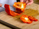 Cooking Class - Authentic Thai Cuisine: chef slicing a red pepper on wooden board