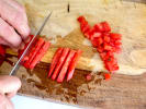 Team Building Cooking Class - Handcrafted Comfort Cuisine in South Bay & Peninsula: chef slicing and dicing tomatoes