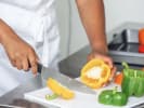 Cooking Class - Flavors of Baja: Mexican Fajitas & Churros: chef slicing bell peppers