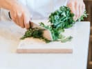 Cooking Class - South Indian Breakfast Feast in Manhattan: chef slicing cilantro