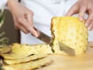 Cooking Class - Handcrafted Fruit Tarts: chef slicing fresh pineapple