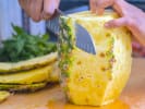 Cooking Class - Hearty Soul Food Staples in DC: chef slicing fresh pineapple
