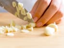 Team Building Cooking Class - Charcuterie Challenge in DC: chef slicing garlic