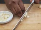 Online Cooking Class - Authentic Cubanos and Mojitos: chef slicing garlic