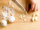Cooking Class - An Exquisite Valentine's Celebration in Northern Virginia: chef slicing garlic