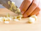 Online Cooking Class - Indian-Chinese Fusion in Downtown Toronto: chef slicing garlic