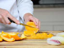 Cooking Class - Traditional Thai Comfort Breakfast: chef slicing oranges