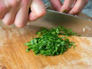 Cooking Class - Upscale Cocktail Hour Eats: chef slicing parsley