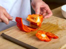 Cooking Class - Best of Korean Barbecue in Jersey City: chef slicing red bell pepper