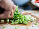 Cooking Class - Colorful Cuisine in Cambridge: chef slicing scallions
