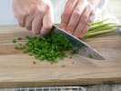 Online Cooking Class - Beijing Noodles and Scallion Pancakes: chef slicing scallions