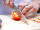 Cooking Class - Classic Bistro Dishes in Manhattan: chef slicing tomatoes for a salad