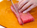 Cooking Class - Home-Style Flavors From Asia in Raleigh: chef slicing tuna