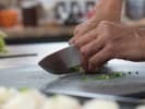 Cooking Class - Basic Knife Techniques in South Seattle: chef slicing with a knife