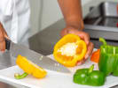 Cooking Class - Lively Flavors of Spain: chef slicing yellow and green bell peppers