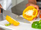 Cooking Class - Fusion of Asian Flavors: chef slicing yellow and green bell peppers