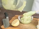 Cooking Class - Gourmet Pizza-Making Essentials: chef spooning scratch made pesto sauce into a bowl