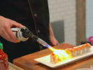 Cooking Class - Sushi Rolls at the Infinity Towers in San Francisco: chef torching sushi roll