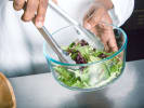 Cooking Class - Vegan Italian Feast: chef tossing green salad