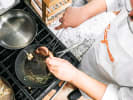 Cooking Class - Golden Steakhouse Feast - Date Night in Downtown Dallas: chef cooking steak in pan