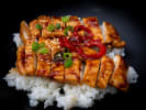 Cooking Class - Modern Hibachi Feast in Northern Virginia: chicken Teriyaki on a bed of rice with scallop and chili garnish