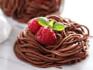 Cooking Class - Pasta Creations: From Starter to Dessert: chocolate pasta nests topped with raspberry and basil garnish