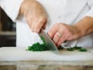Cooking Class - Sophisticated Spanish Tapas in Austin: chopping herbs