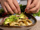 Team Building Cooking Class - Mexican Fiesta Dinner Team Building in Boston in Boston Proper: close up shot of plating enchiladas