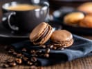 Cooking Class - Charming Shamrock Macarons in Manhattan: coffee macarons with a cup of coffee in the background and coffee beans on the side