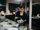 Cooking Class - Mexican Fiesta Dinner Night in Boston in Boston Proper: cooing class participant plating enchiladas