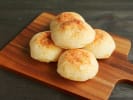 Cooking Class - Authentic Brazilian Feast: Pão de Queijo on a wooden board