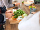 Team Building Cooking Class - Triple Guacamole Making Challenge in Dallas: cutting cilantro for guacamole