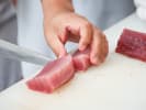 Cooking Class - Sushi-Making for Beginners in Charlotte: cutting tuna with a knife